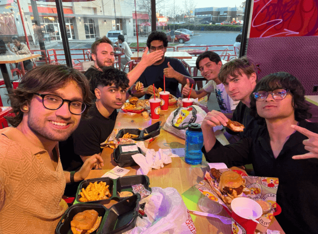 Rafan and friends sharing a meal